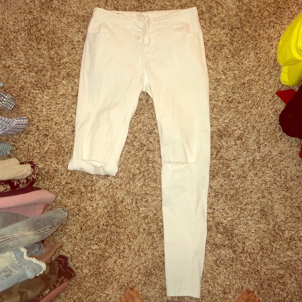 White drawstring waist jeans with ripped knees
